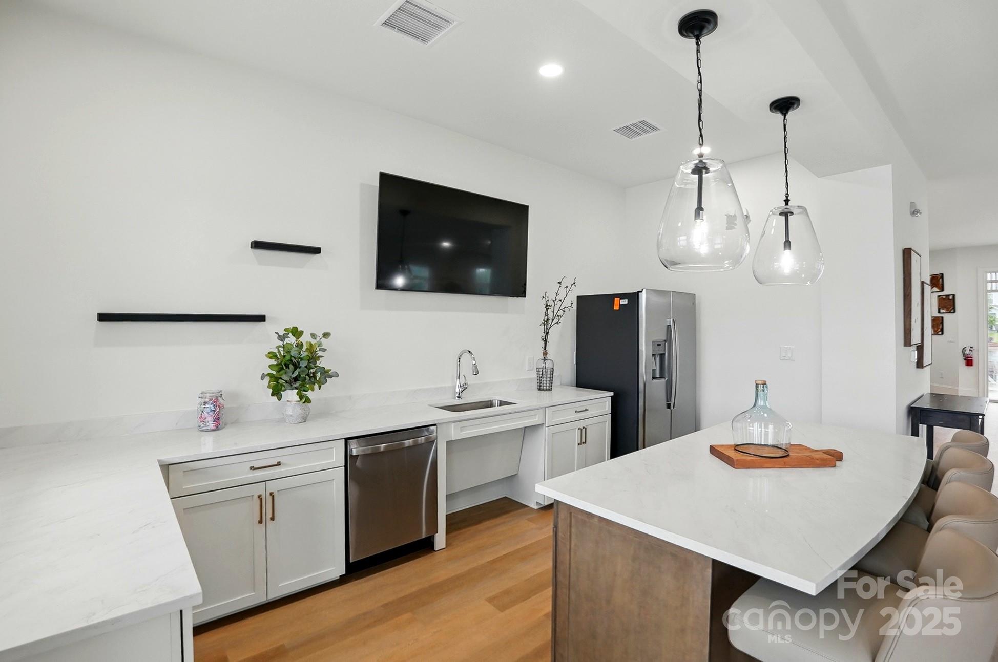 2241 Tabor Road Sherrills Ford, NC 28673 - Photo 34 of 38 a kitchen with white cabinets and stainless steel appliances