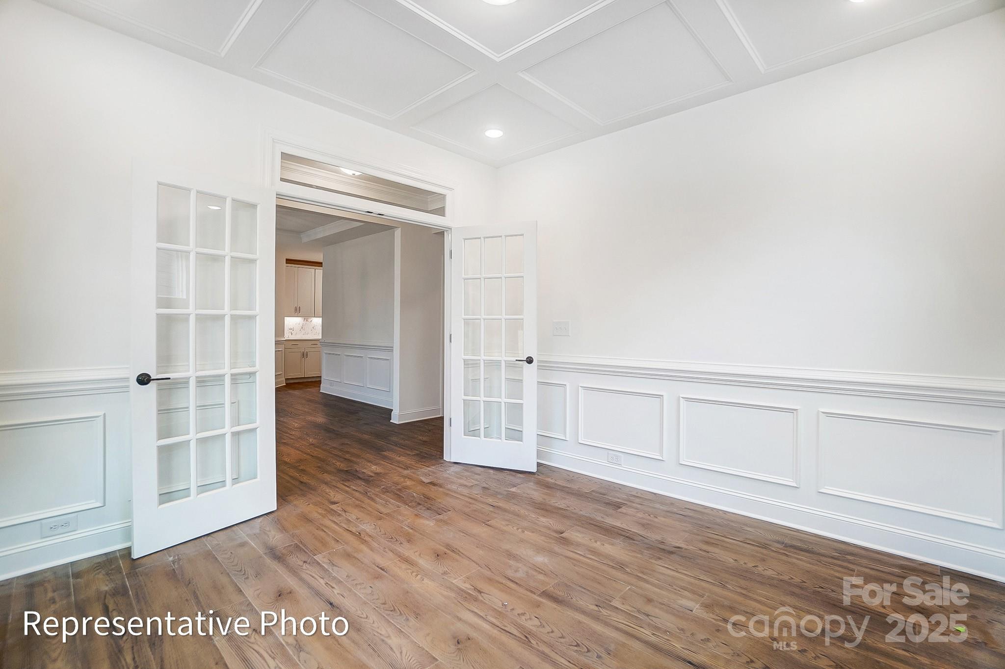 2241 Tabor Road Sherrills Ford, NC 28673 - Photo 5 of 38 an empty room with wooden floor and cabinet