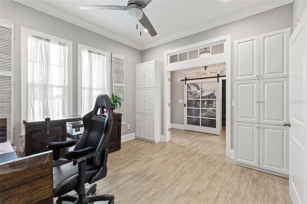 15710 Colding Loop Wimauma, FL 33598 - Photo 18 of 41 a view of a workspace with furniture and a window