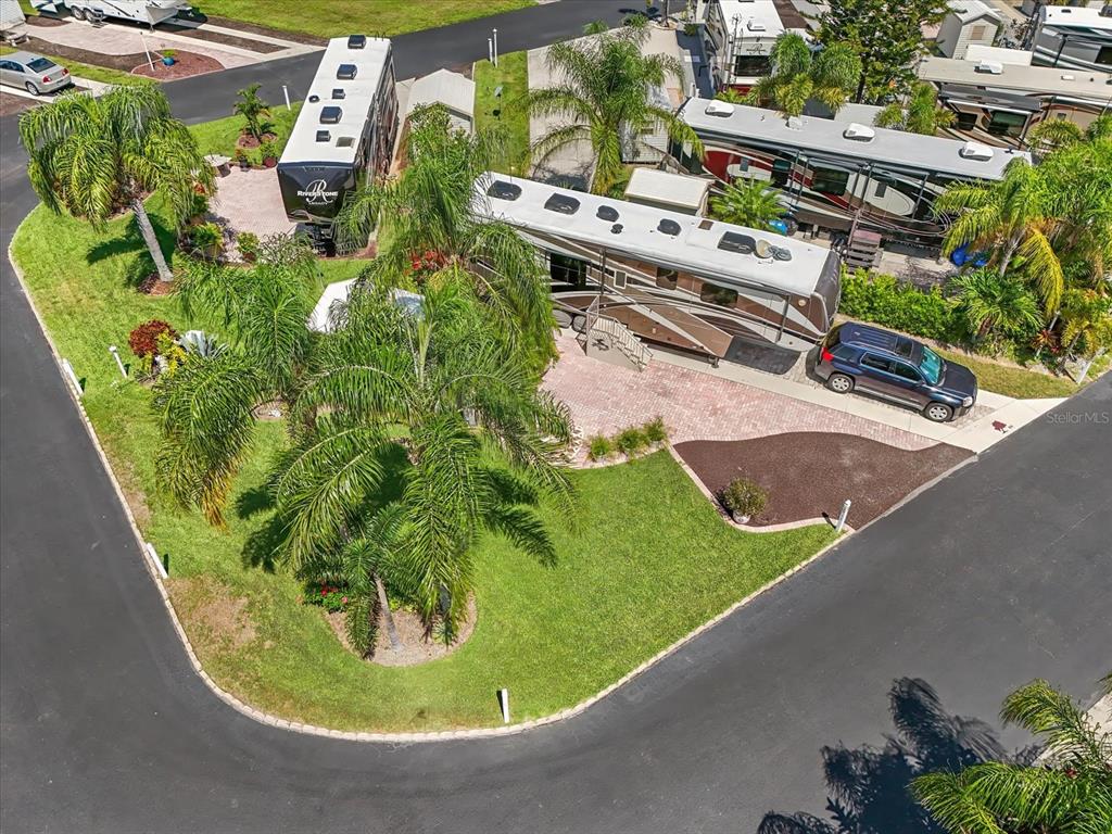 2911 Birdie Drive, Unit 85 Bowling Green, FL 33834 - Photo 1 of 16 a view of a garden with a sitting area