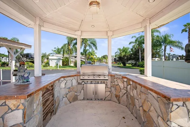 an aerial view of residential houses with outdoor space and swimming pool