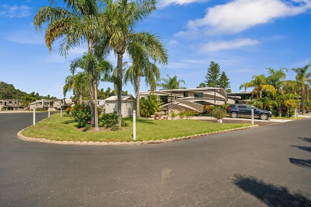 2911 Birdie Drive, Unit 85 Bowling Green, FL 33834 - Photo 3 of 16 a view of a basket ball ground with palm trees