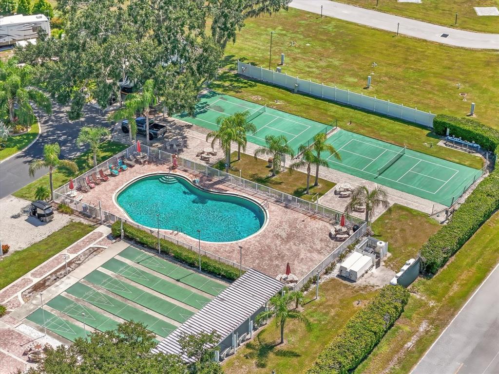 2911 Birdie Drive, Unit 85 Bowling Green, FL 33834 - Photo 10 of 16 a view of a swimming pool with a patio