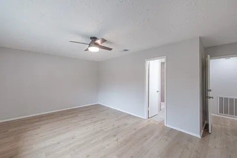 a view of a livingroom with a kitchen