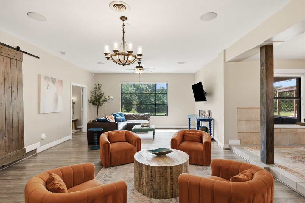 12135 Fitzhugh Road Austin, TX 78736 - Photo 7 of 30 a living room with furniture kitchen view and a large window
