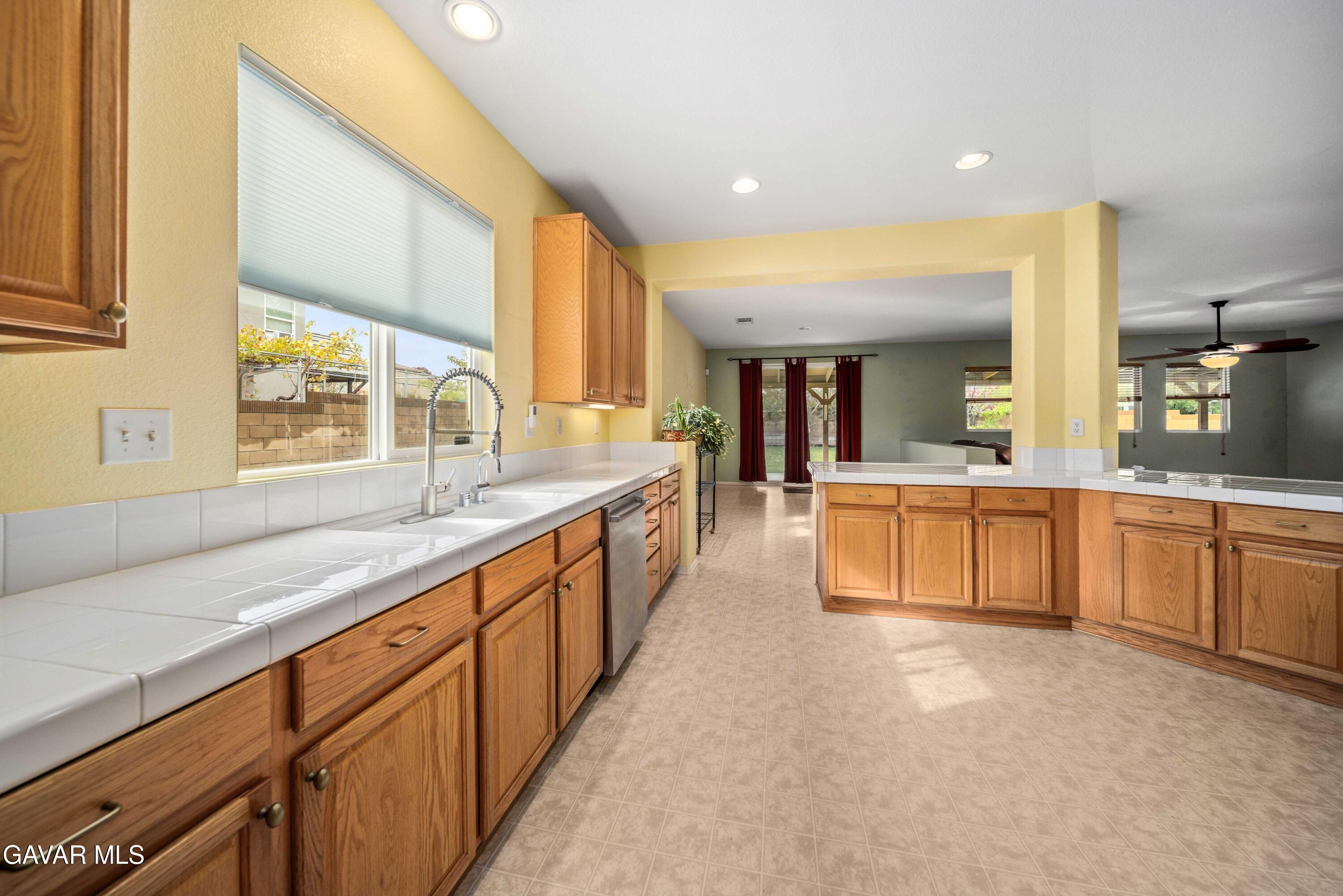 43219 Fanchon Avenue Lancaster, CA 93536 - Photo 14 of 51 a large bathroom with a large window and double vanity