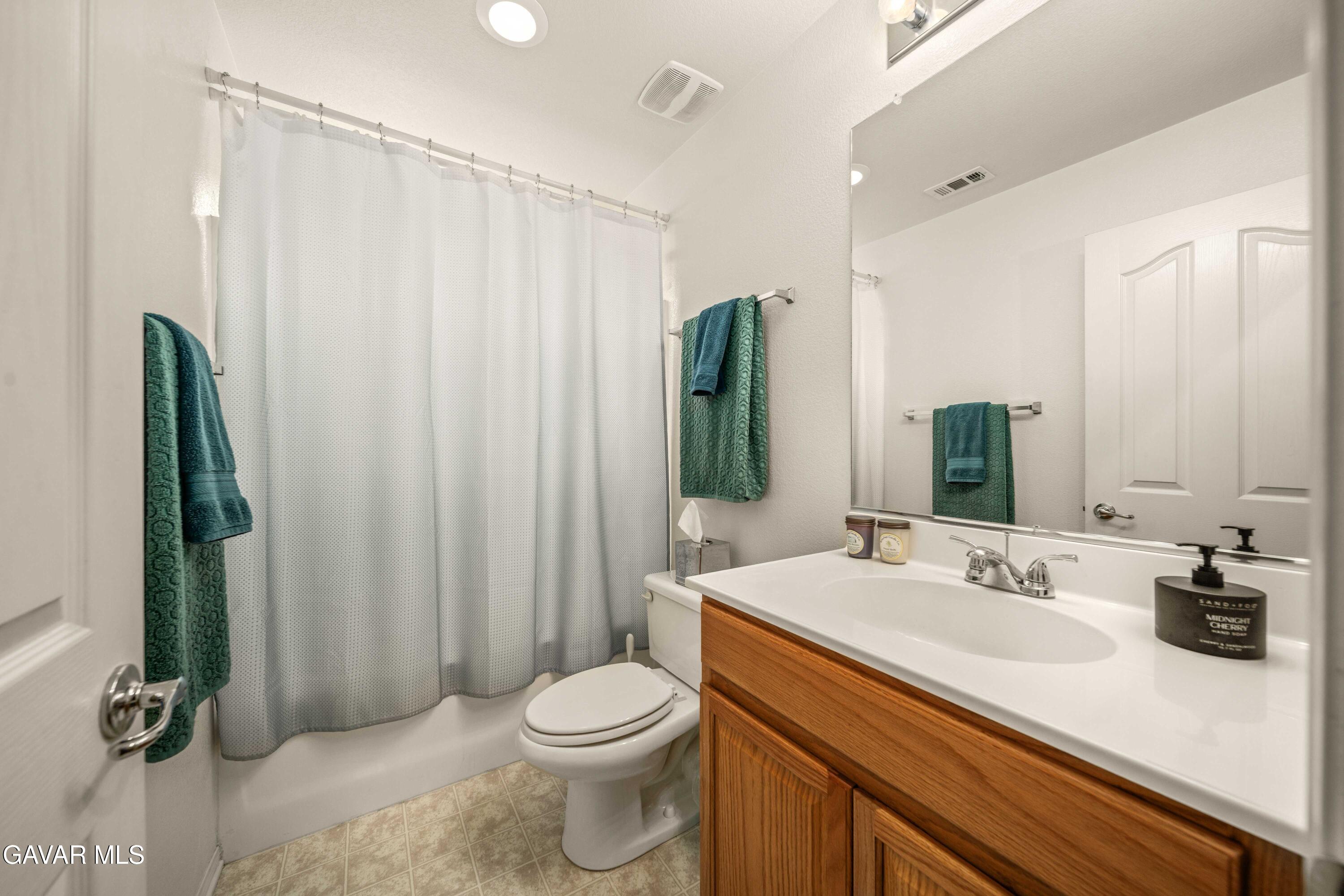 43219 Fanchon Avenue Lancaster, CA 93536 - Photo 19 of 51 a bathroom with a sink a toilet and shower