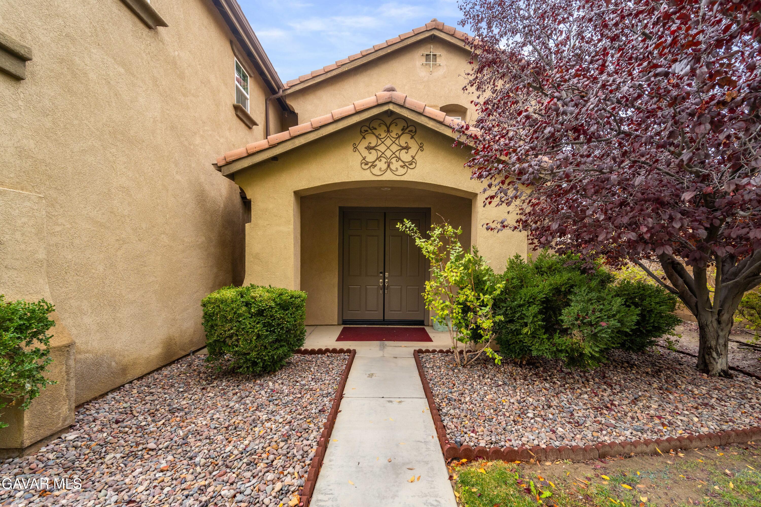 43219 Fanchon Avenue Lancaster, CA 93536 - Photo 3 of 51 a front view of a house with garden