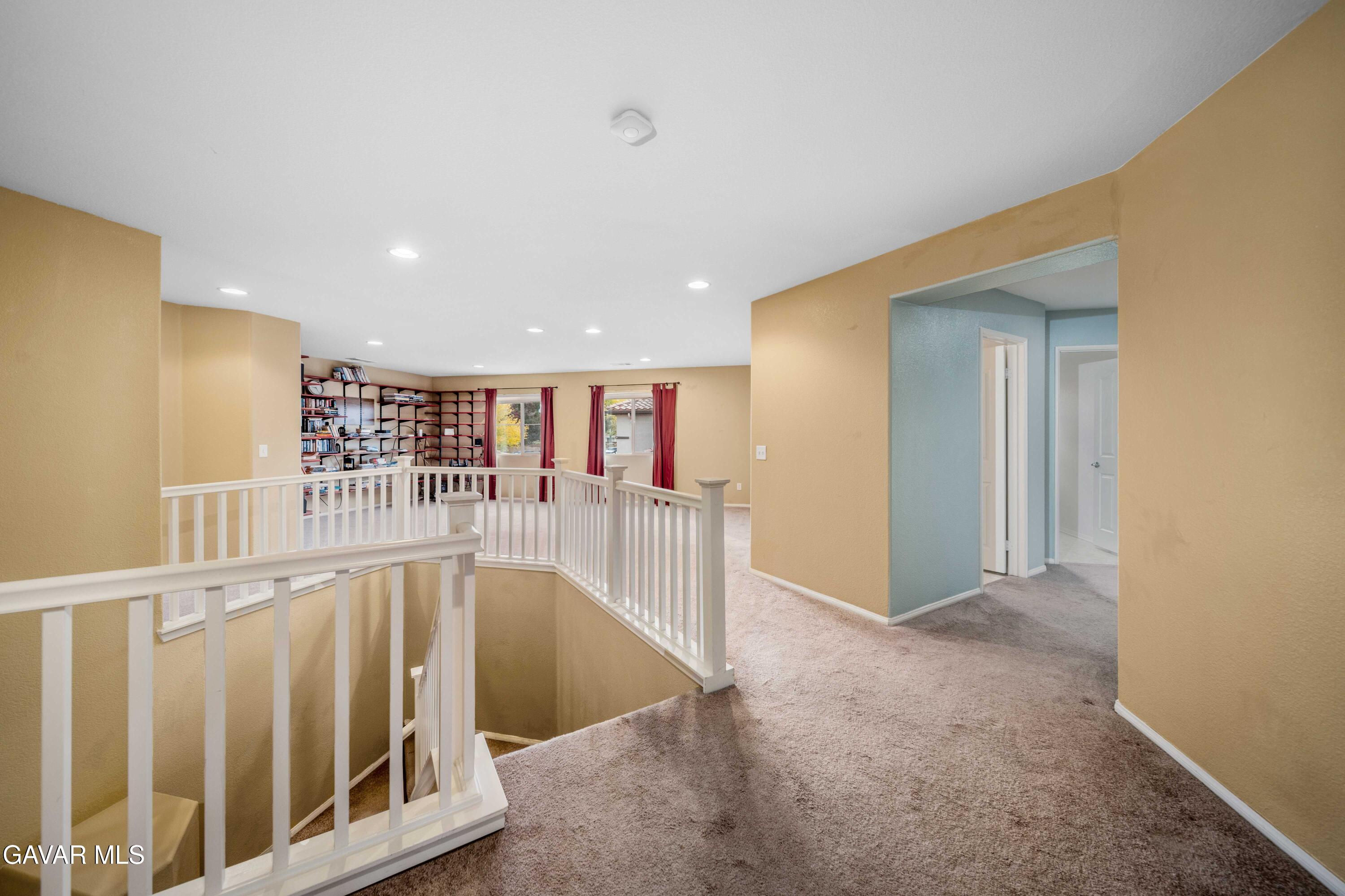 43219 Fanchon Avenue Lancaster, CA 93536 - Photo 32 of 51 a view of a hallway with wooden floor