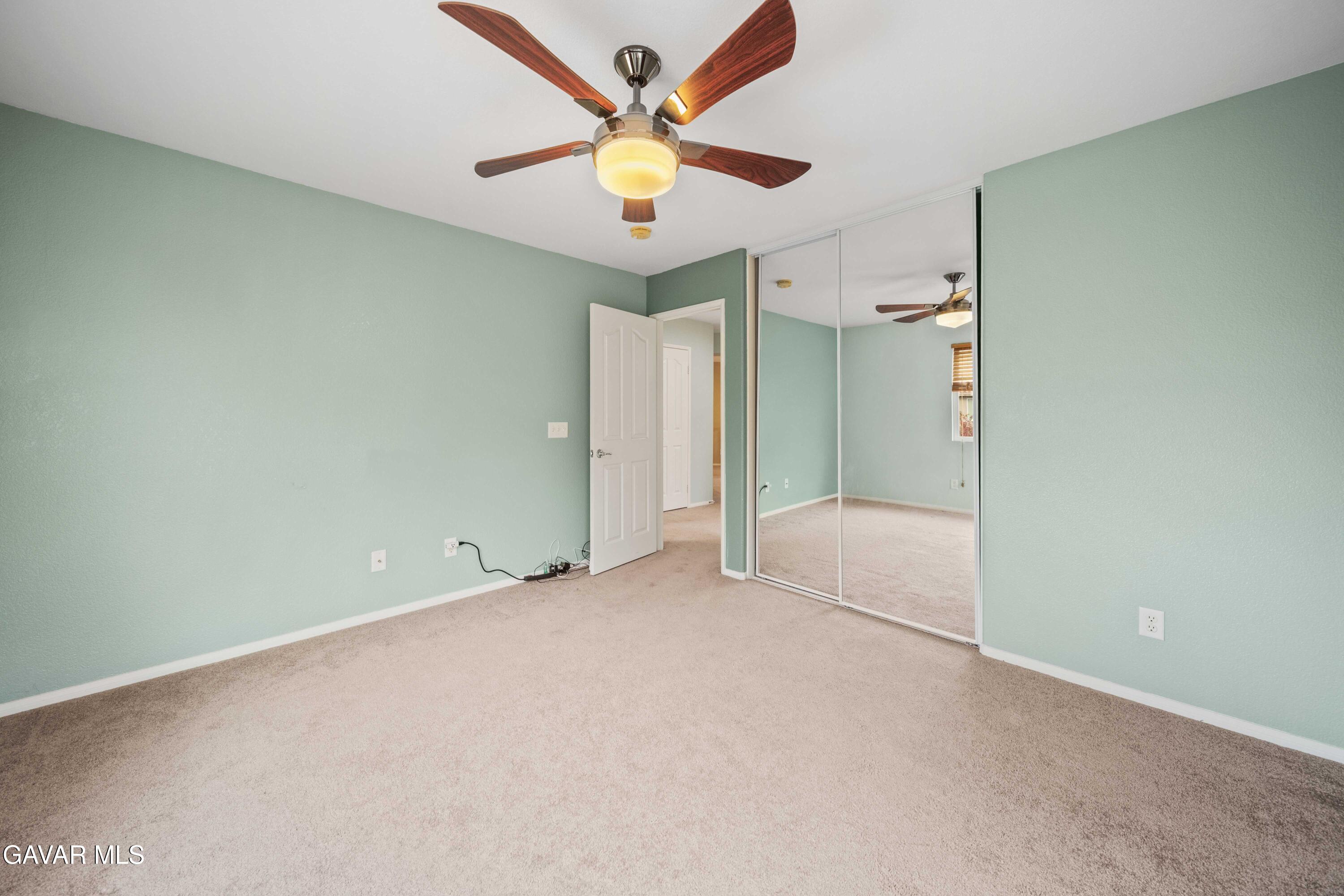 43219 Fanchon Avenue Lancaster, CA 93536 - Photo 34 of 51 an empty room with closet and a ceiling fan