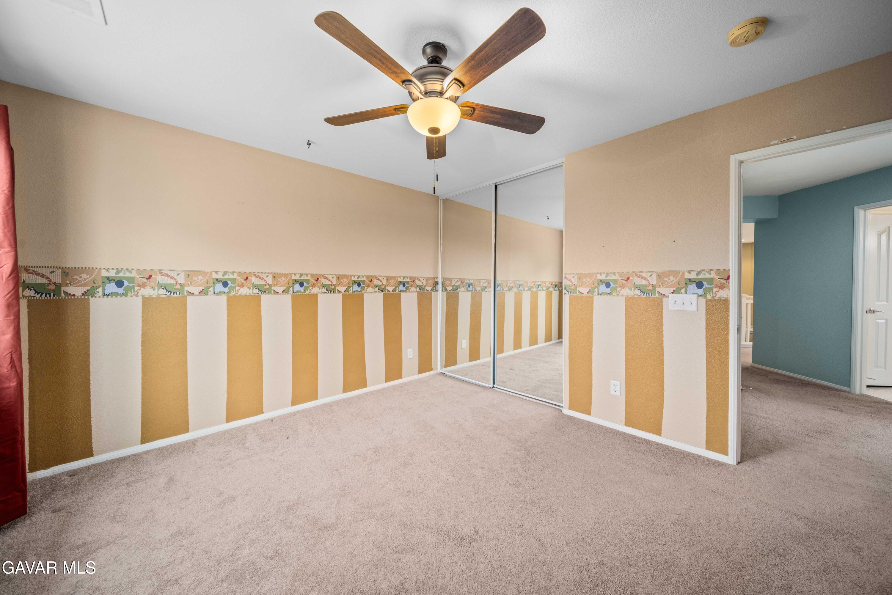 43219 Fanchon Avenue Lancaster, CA 93536 - Photo 38 of 51 a view of a water heater room with a ceiling fan