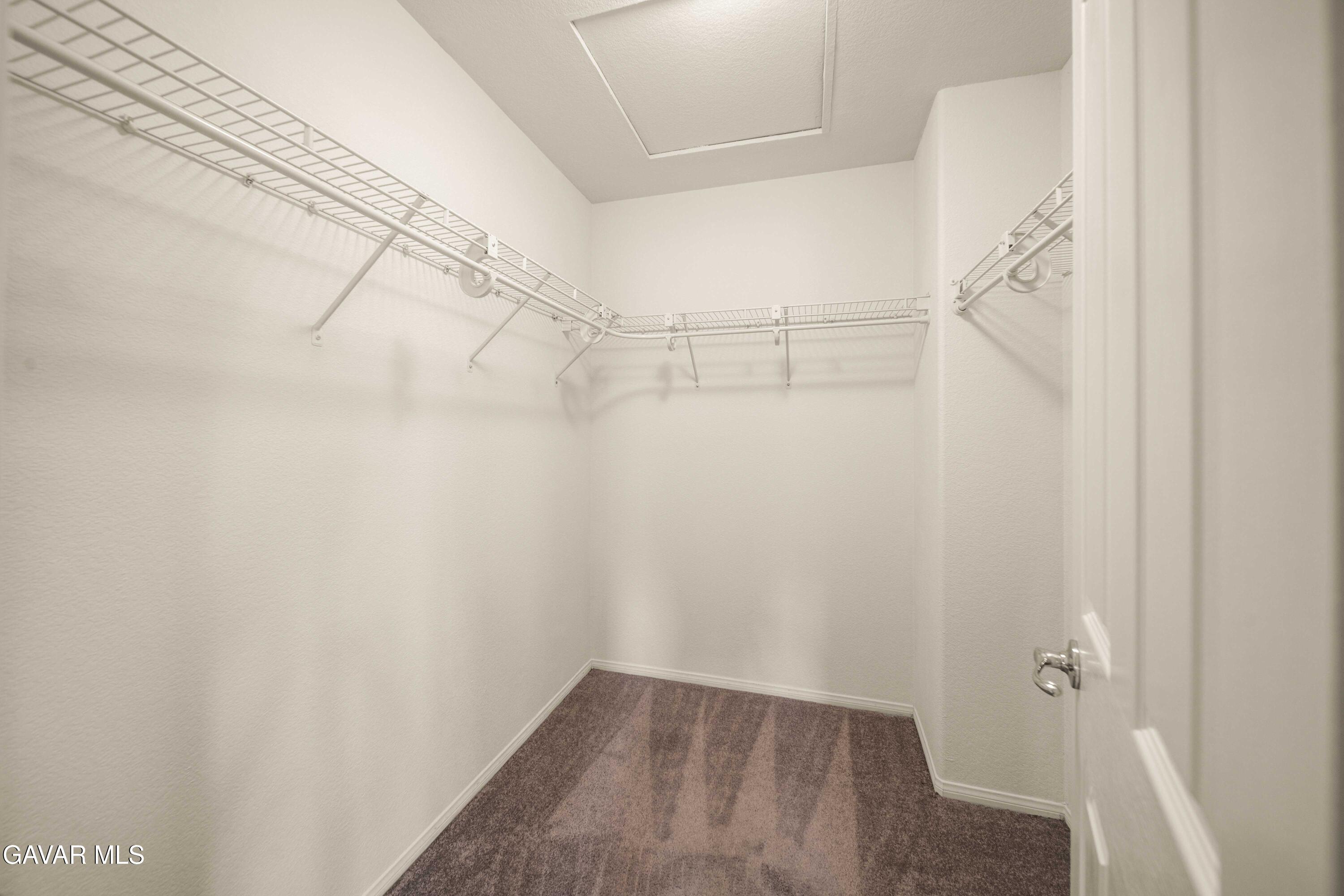 43219 Fanchon Avenue Lancaster, CA 93536 - Photo 40 of 51 a view of a room with racks on the wall