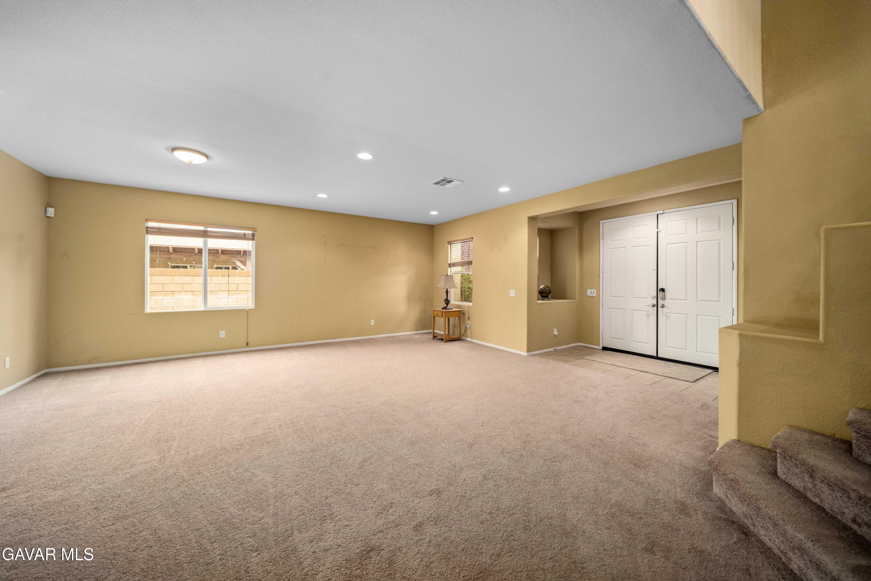 43219 Fanchon Avenue Lancaster, CA 93536 - Photo 5 of 51 a view of an empty room with a window