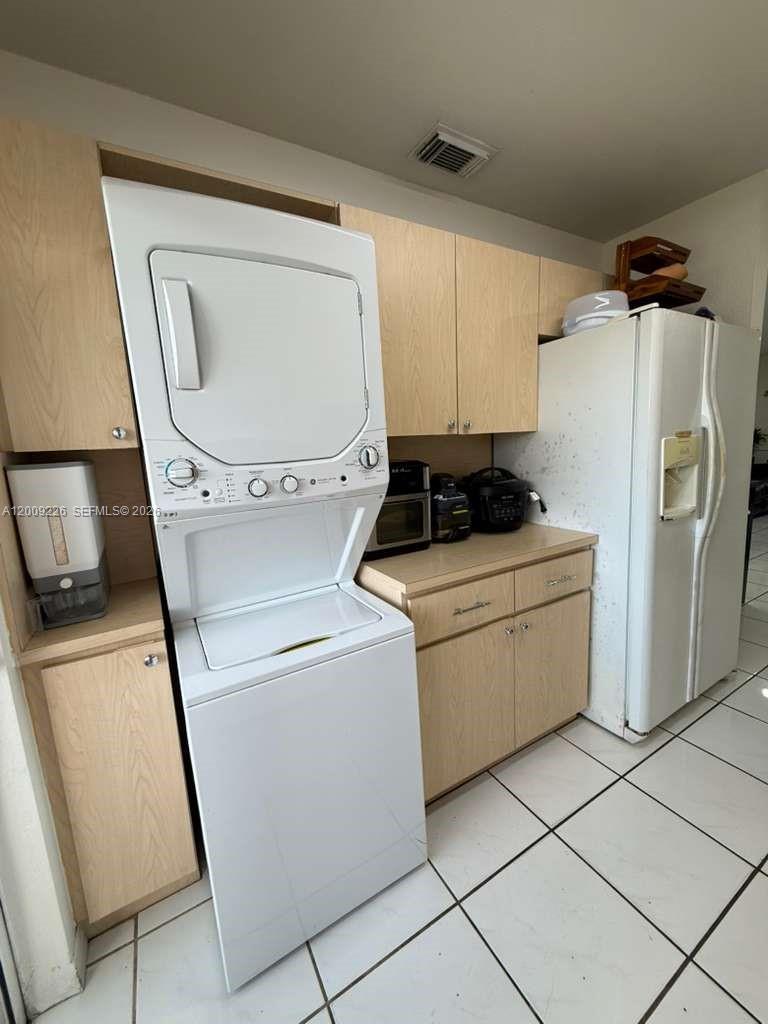 3514 West 76th Street, Unit 203 Hialeah, FL 33018 - Photo 13 of 39 a utility room with dryer and washer