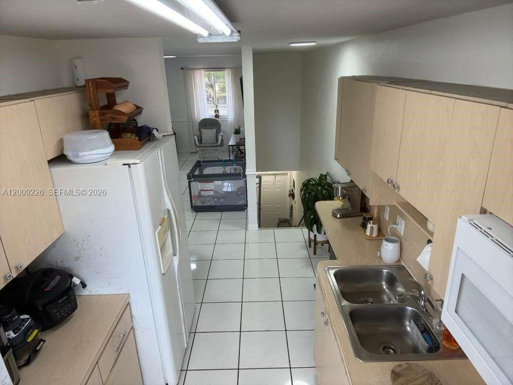 3514 West 76th Street, Unit 203 Hialeah, FL 33018 - Photo 15 of 39 a room with two washing machine