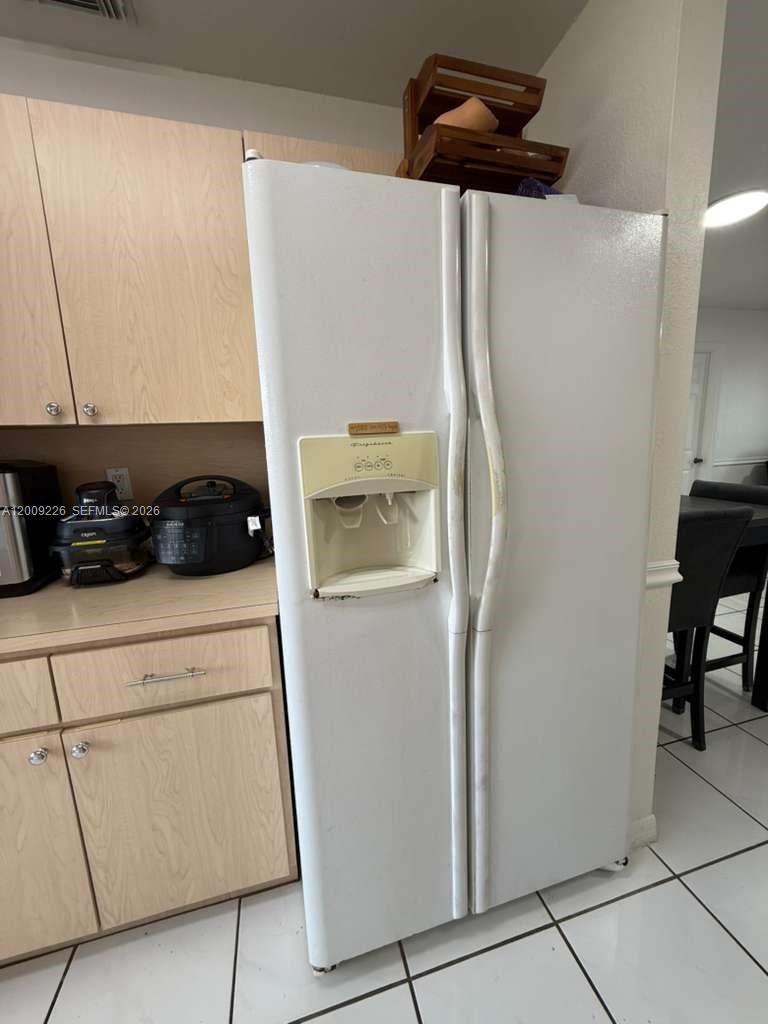 3514 West 76th Street, Unit 203 Hialeah, FL 33018 - Photo 17 of 39 a kitchen with a refrigerator and a stove