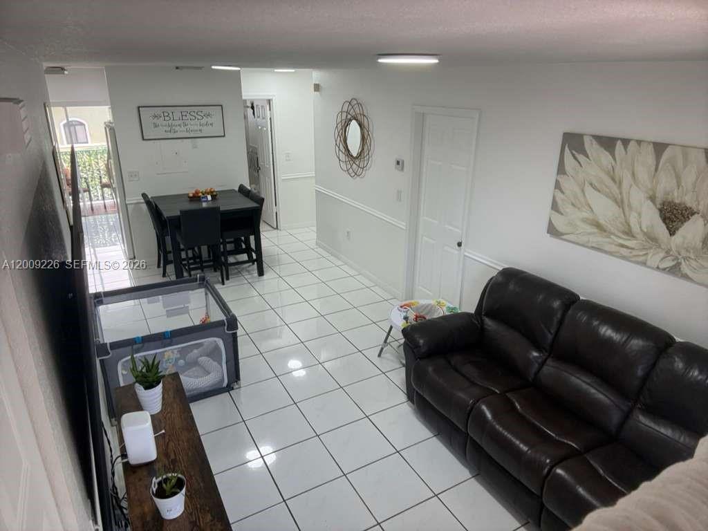 3514 West 76th Street, Unit 203 Hialeah, FL 33018 - Photo 2 of 39 a living room with furniture