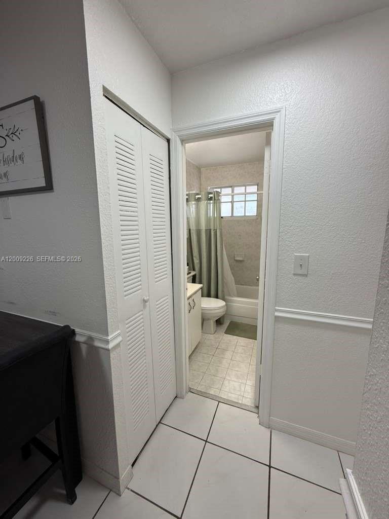 3514 West 76th Street, Unit 203 Hialeah, FL 33018 - Photo 21 of 39 a bathroom with a glass door shower and a sink