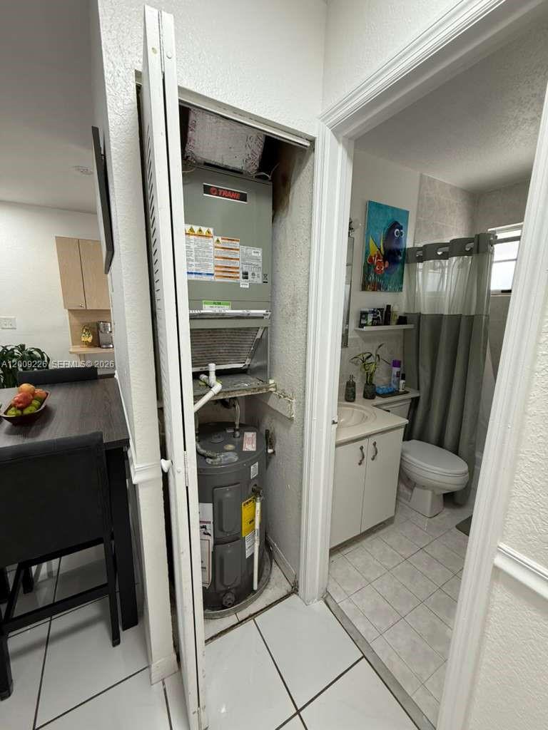 3514 West 76th Street, Unit 203 Hialeah, FL 33018 - Photo 30 of 39 a room with storage and utility