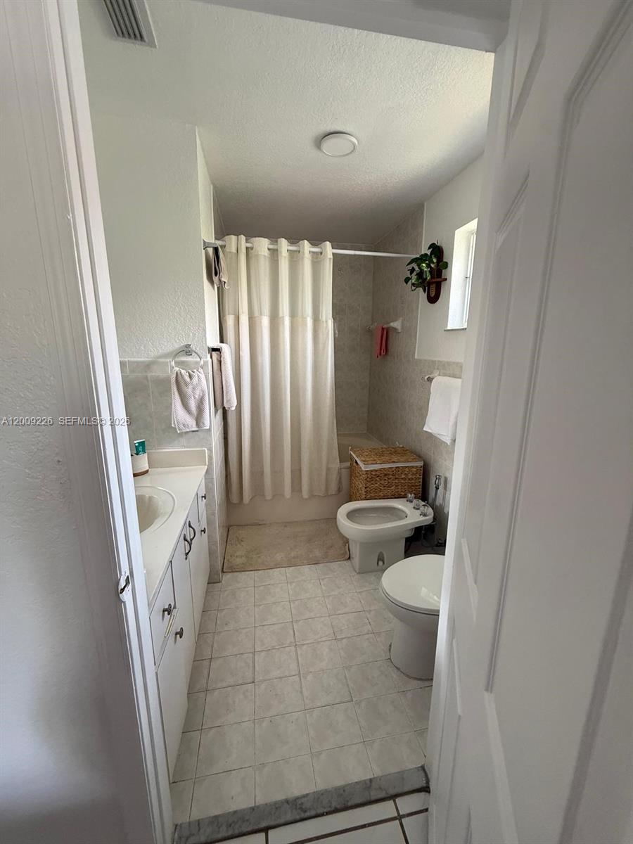 3514 West 76th Street, Unit 203 Hialeah, FL 33018 - Photo 31 of 39 a bathroom with a sink and toilet