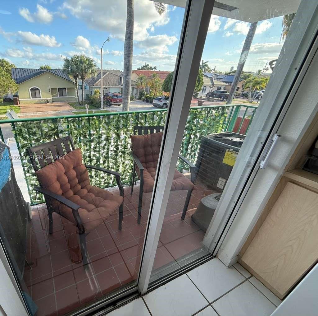 3514 West 76th Street, Unit 203 Hialeah, FL 33018 - Photo 38 of 39 a view of balcony with furniture