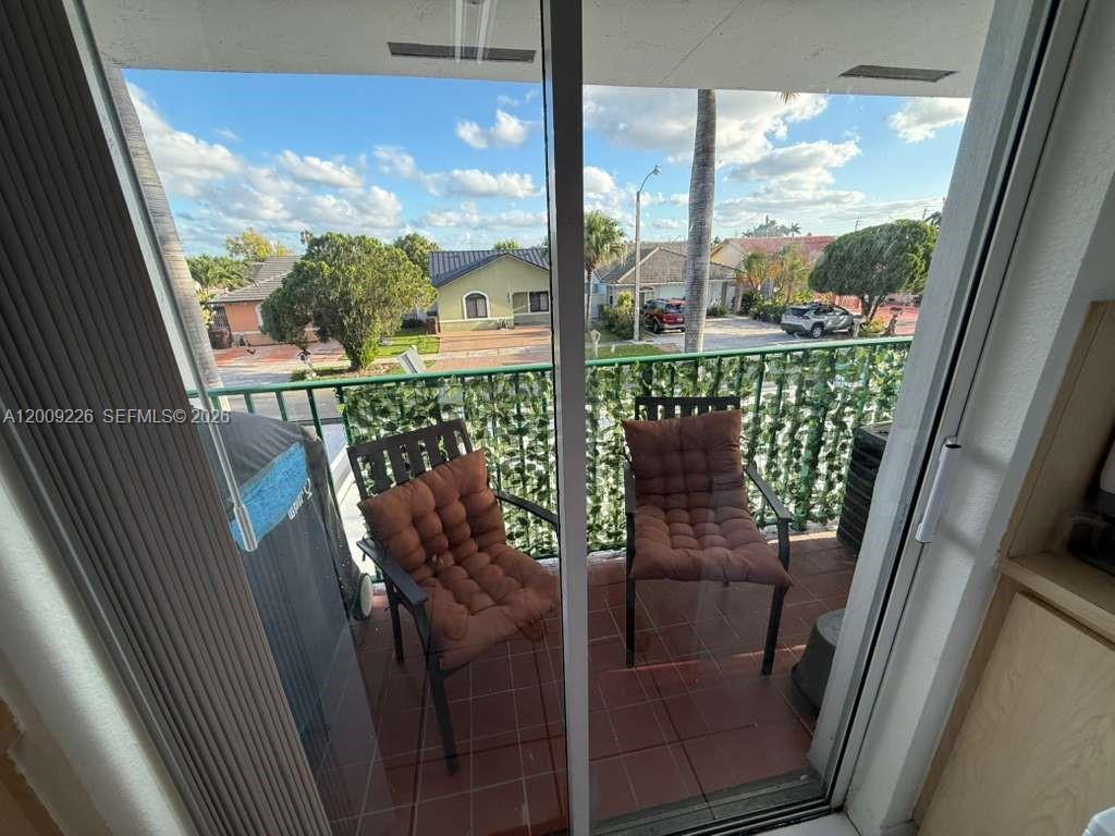3514 West 76th Street, Unit 203 Hialeah, FL 33018 - Photo 39 of 39 a view of a balcony with chairs