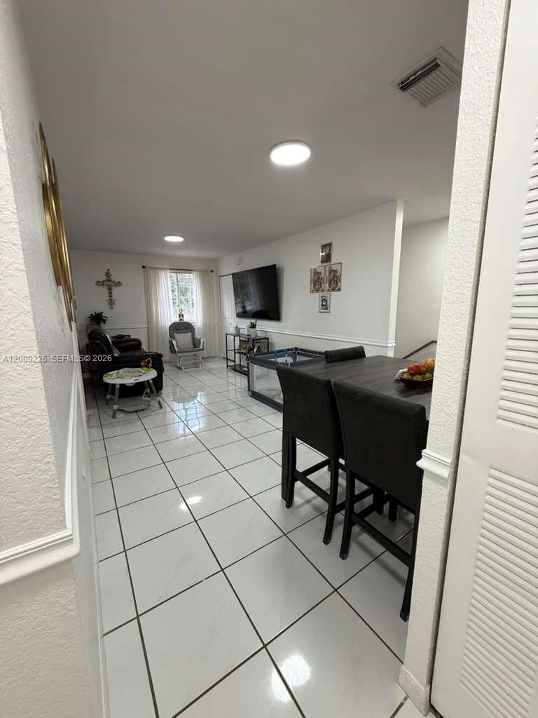 3514 West 76th Street, Unit 203 Hialeah, FL 33018 - Photo 6 of 39 a view of a workspace with furniture