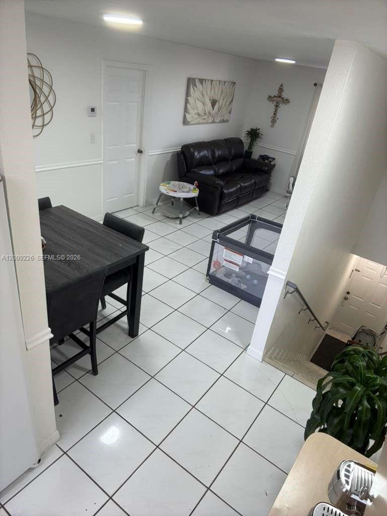 3514 West 76th Street, Unit 203 Hialeah, FL 33018 - Photo 8 of 39 a living room with furniture