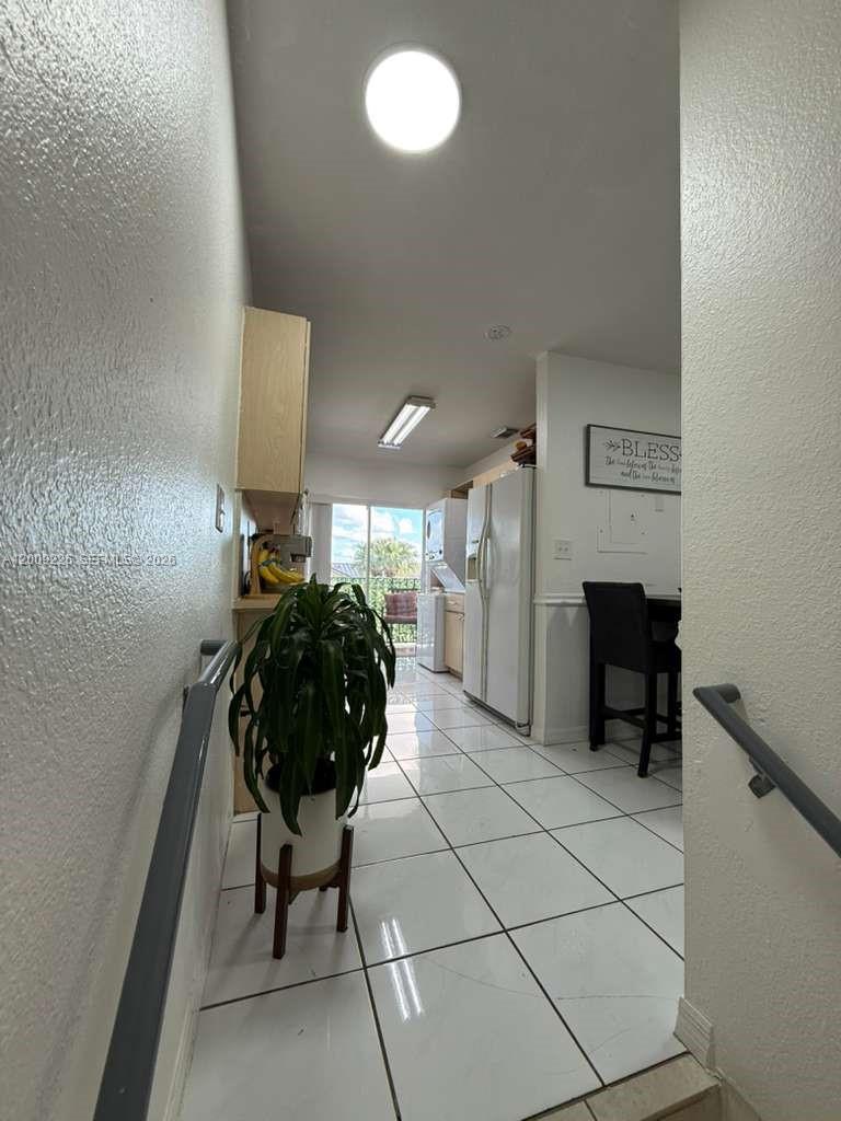 3514 West 76th Street, Unit 203 Hialeah, FL 33018 - Photo 10 of 39 a room with a table and a fireplace