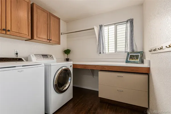 a utility room with sink dryer and washer