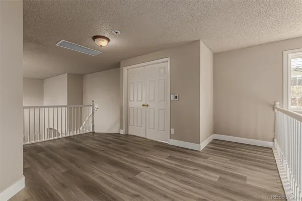 a view of a livingroom with wooden floor