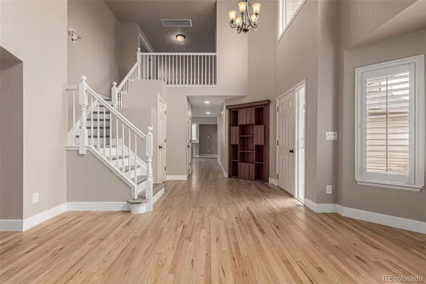 a view of entryway with wooden floor