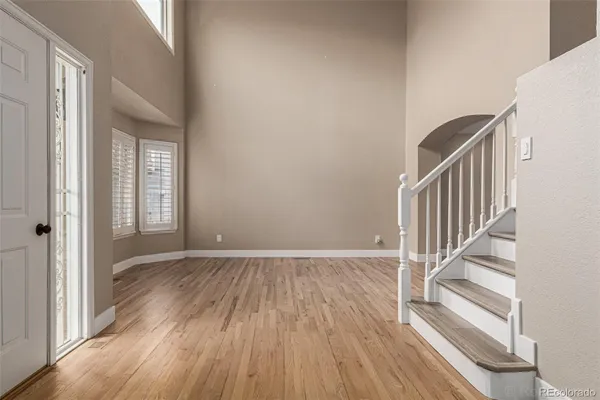 a view of an entryway with wooden floor