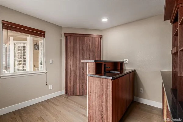 a view of a storage & utility room with wooden floor