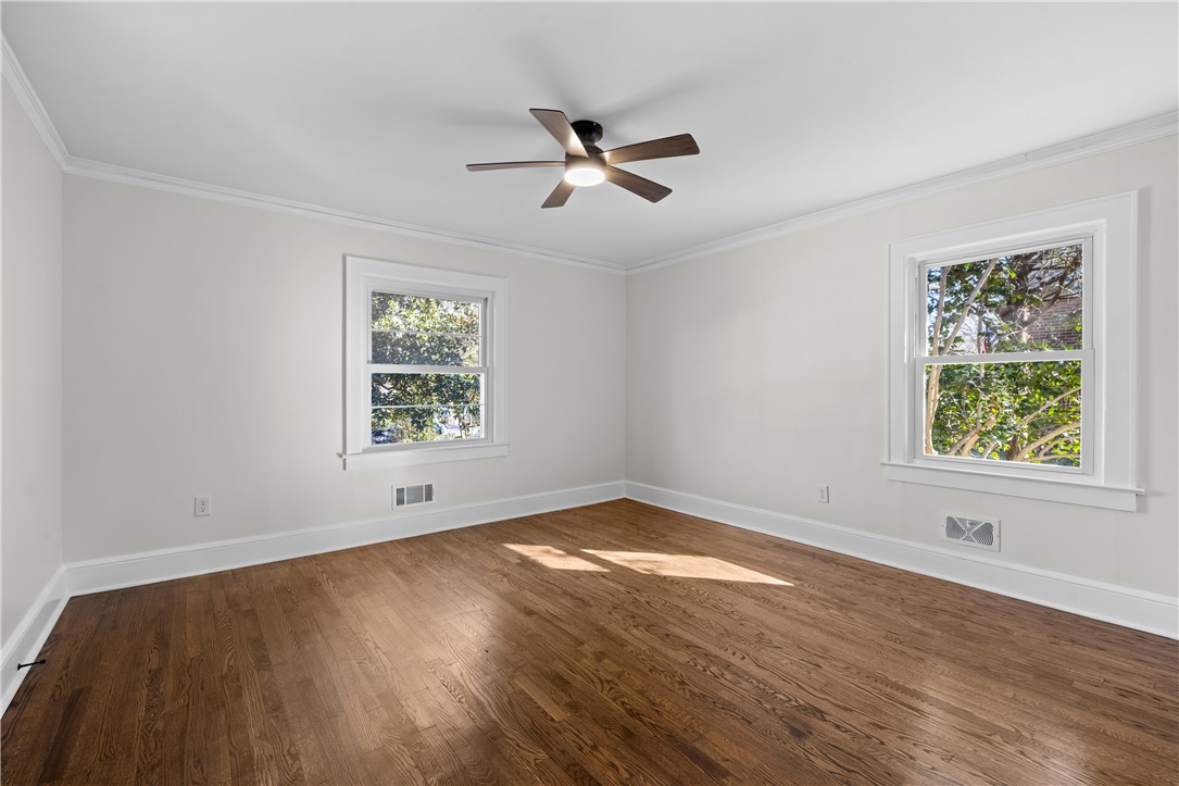 251 Riggs Drive Clemson, SC 29631 - Photo 30 of 37 Rich hardwood flooring complements the classic plaster walls and detailed molding in this versatile room.