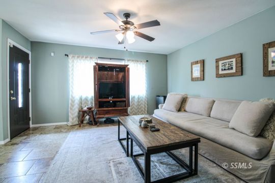 708 West Perdew Avenue Ridgecrest, CA 93555 - Photo 4 of 37 a living room with furniture and a flat screen tv