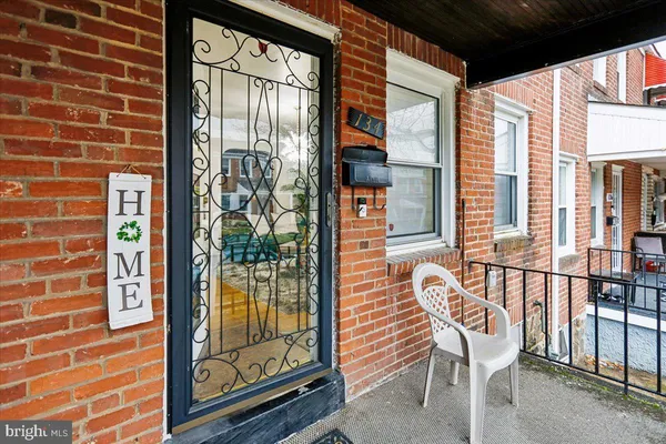 a view of a balcony with a dining table and chairs with outer view