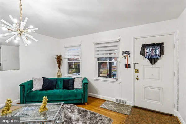 a living room with furniture and a table