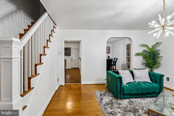 a view of living room with furniture and a fireplace