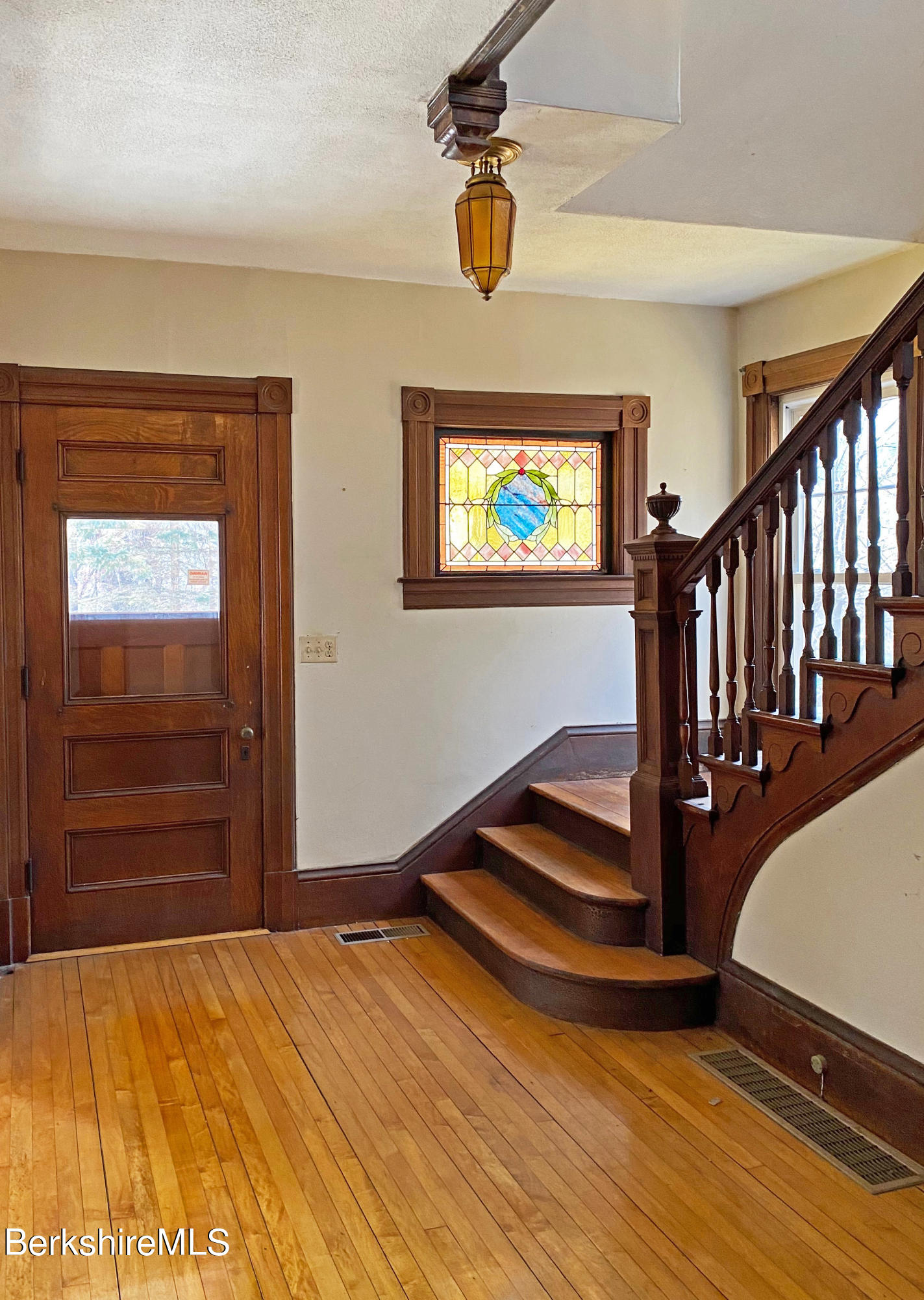 13 Old Chester Road Huntington, MA 01050 - Photo 12 of 26 a view of empty room with stairs and wooden floor