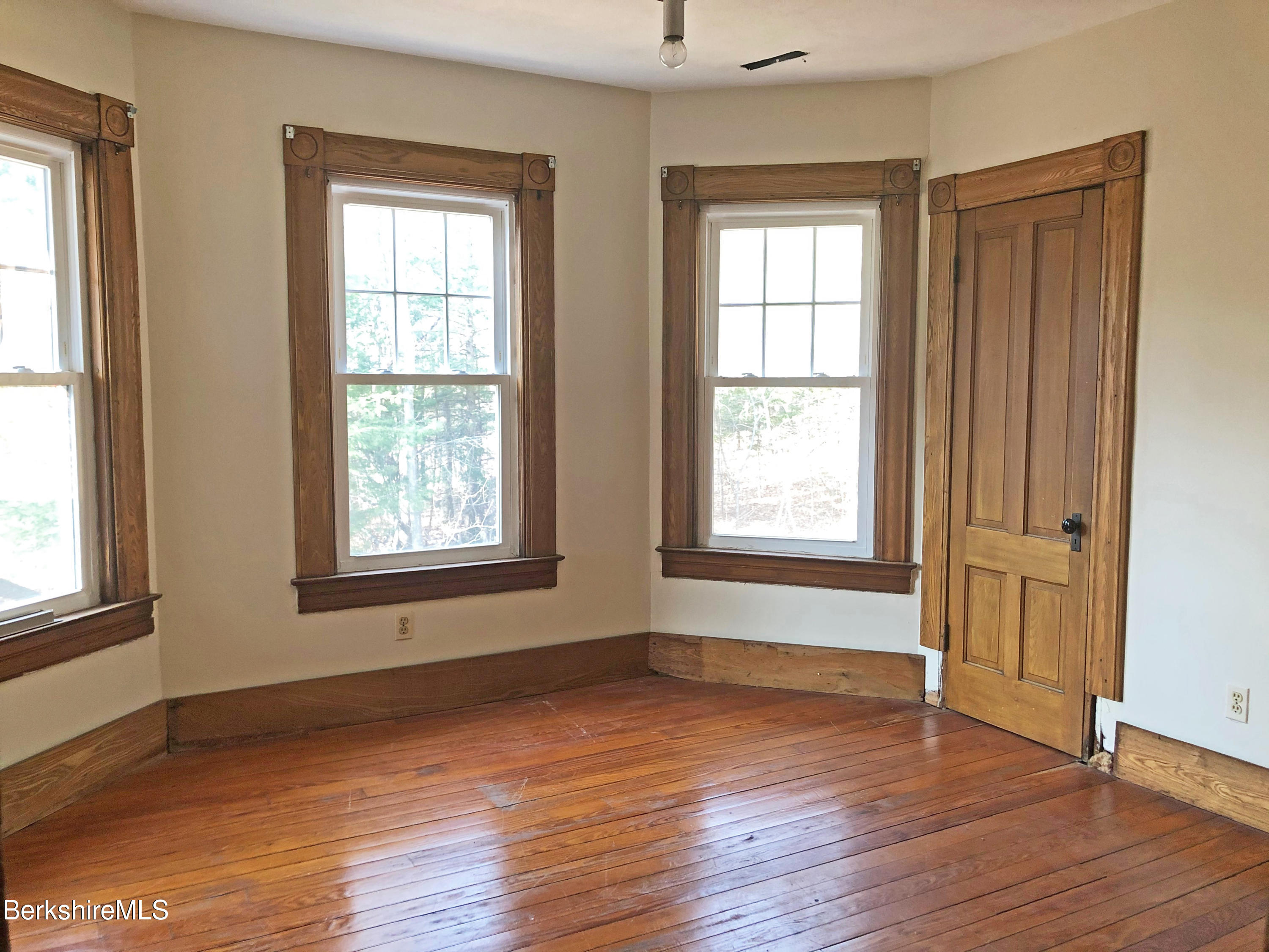 13 Old Chester Road Huntington, MA 01050 - Photo 19 of 26 an empty room with wooden floor and windows