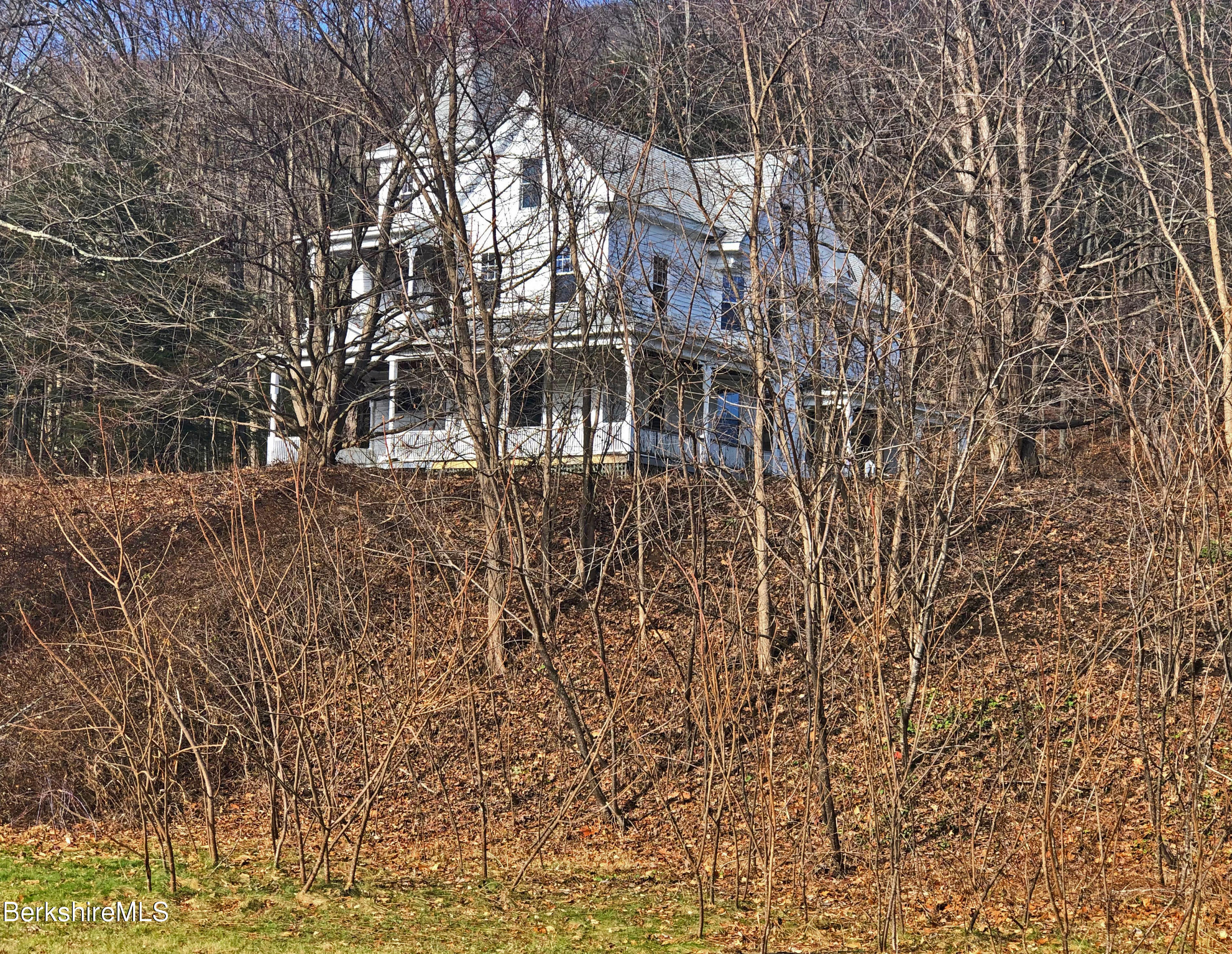 13 Old Chester Road Huntington, MA 01050 - Photo 3 of 26 a front view of a house with a yard