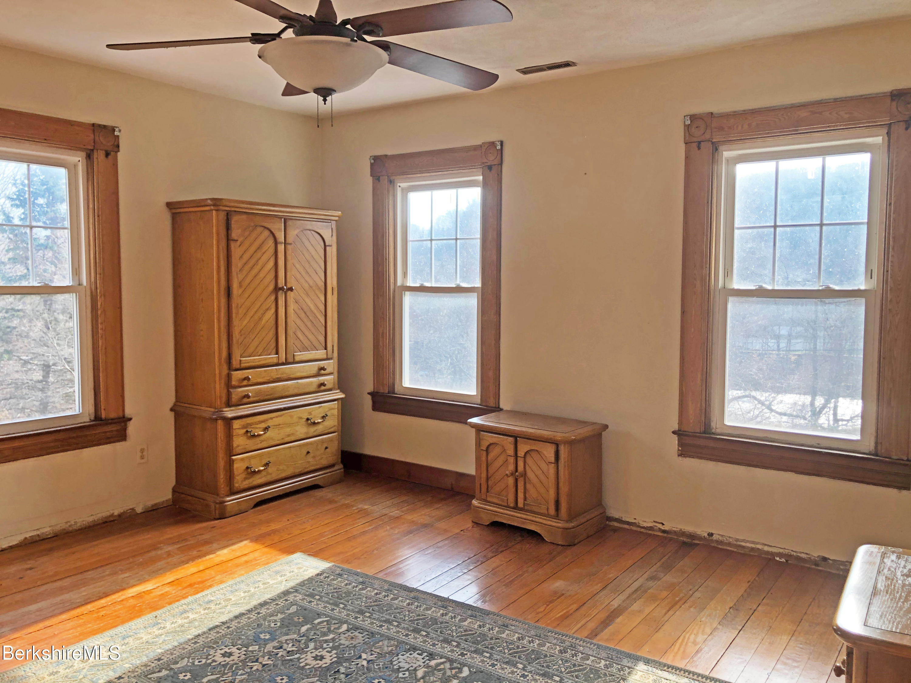 13 Old Chester Road Huntington, MA 01050 - Photo 21 of 26 a view of an empty room with a window and wooden floor