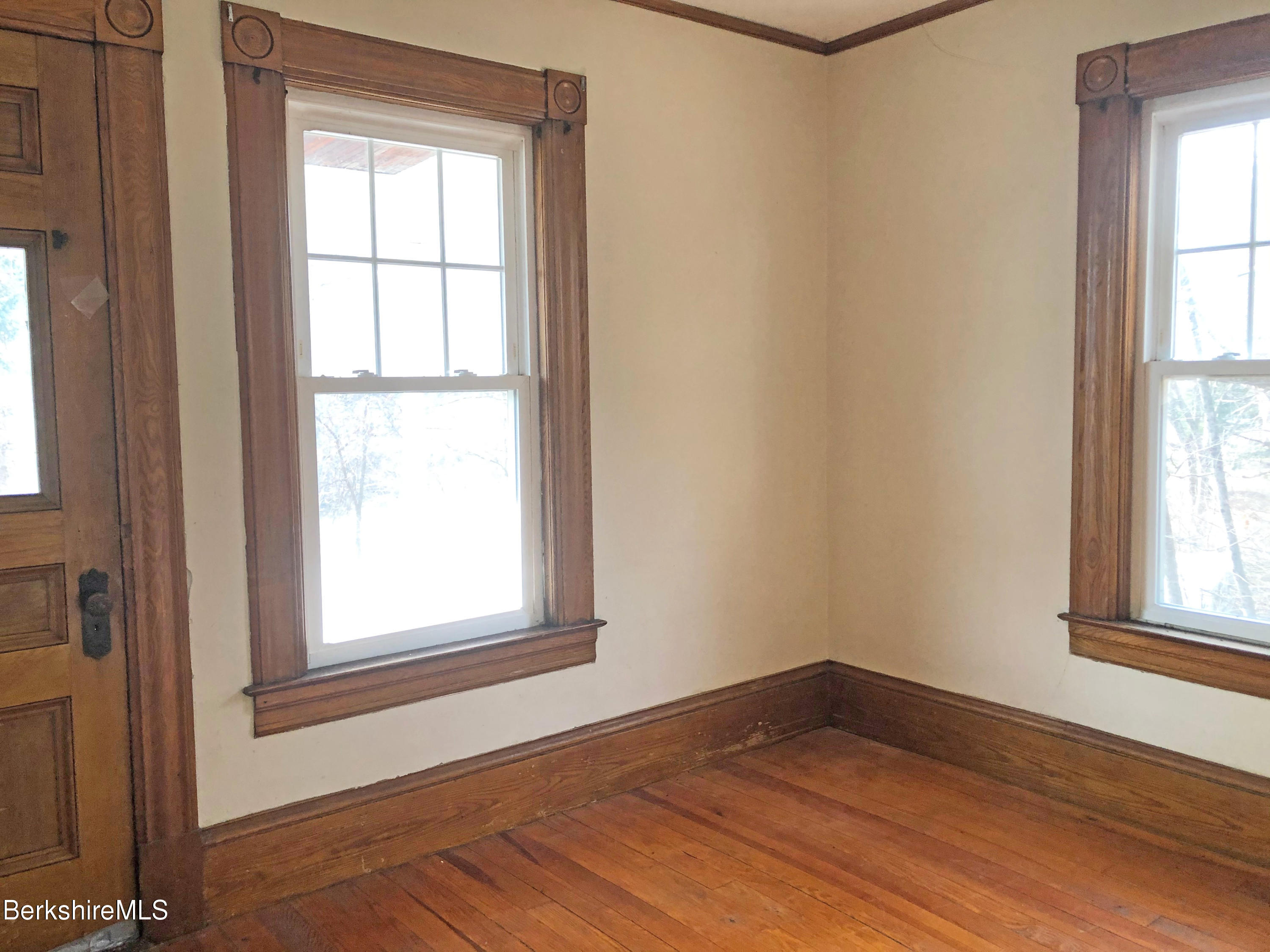 13 Old Chester Road Huntington, MA 01050 - Photo 22 of 26 an empty room with wooden floor and windows