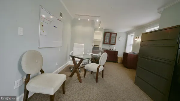 a living room with furniture and a chair