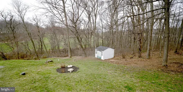 a fire hydrant in the middle of a field