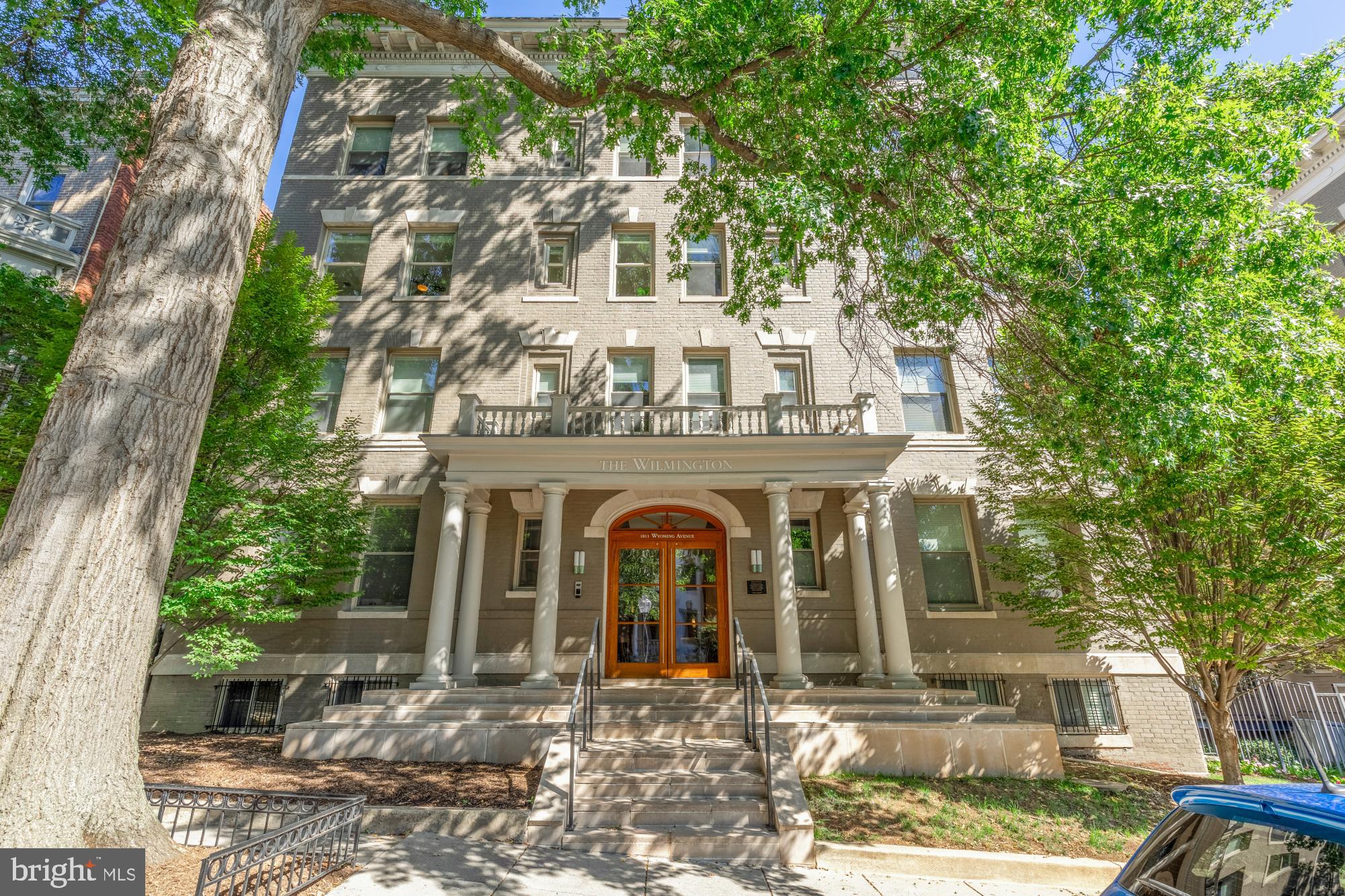 1811 Wyoming Avenue Northwest, Unit 32 Washington, DC 20009 - Photo 1 of 26 a view of a building with large windows and a tree