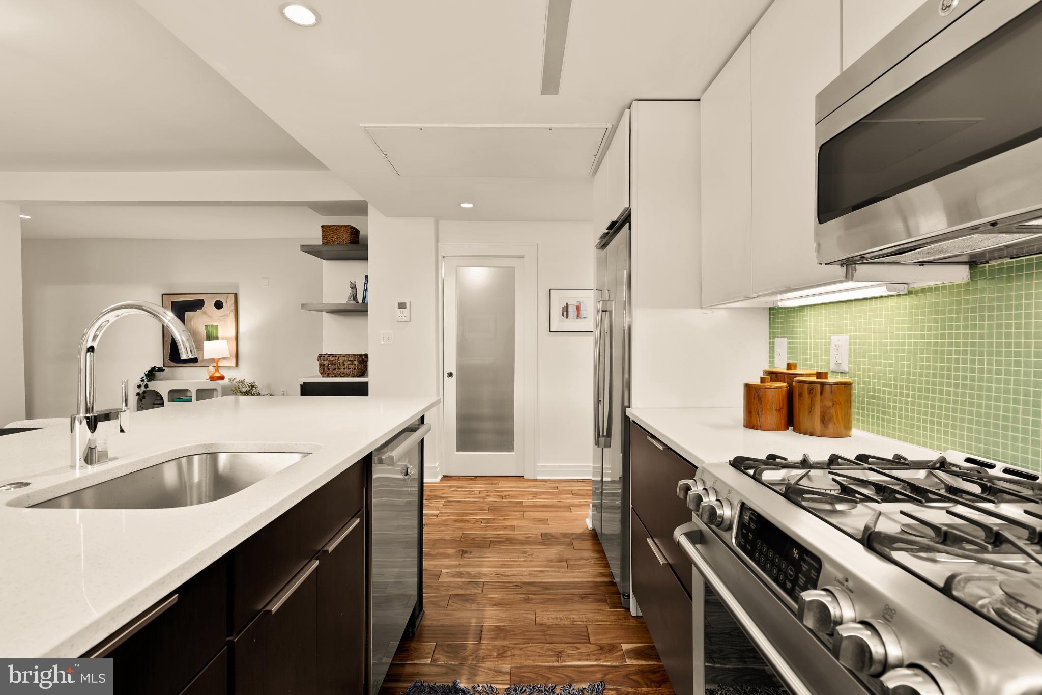 1811 Wyoming Avenue Northwest, Unit 32 Washington, DC 20009 - Photo 14 of 26 a kitchen with sink stove and refrigerator