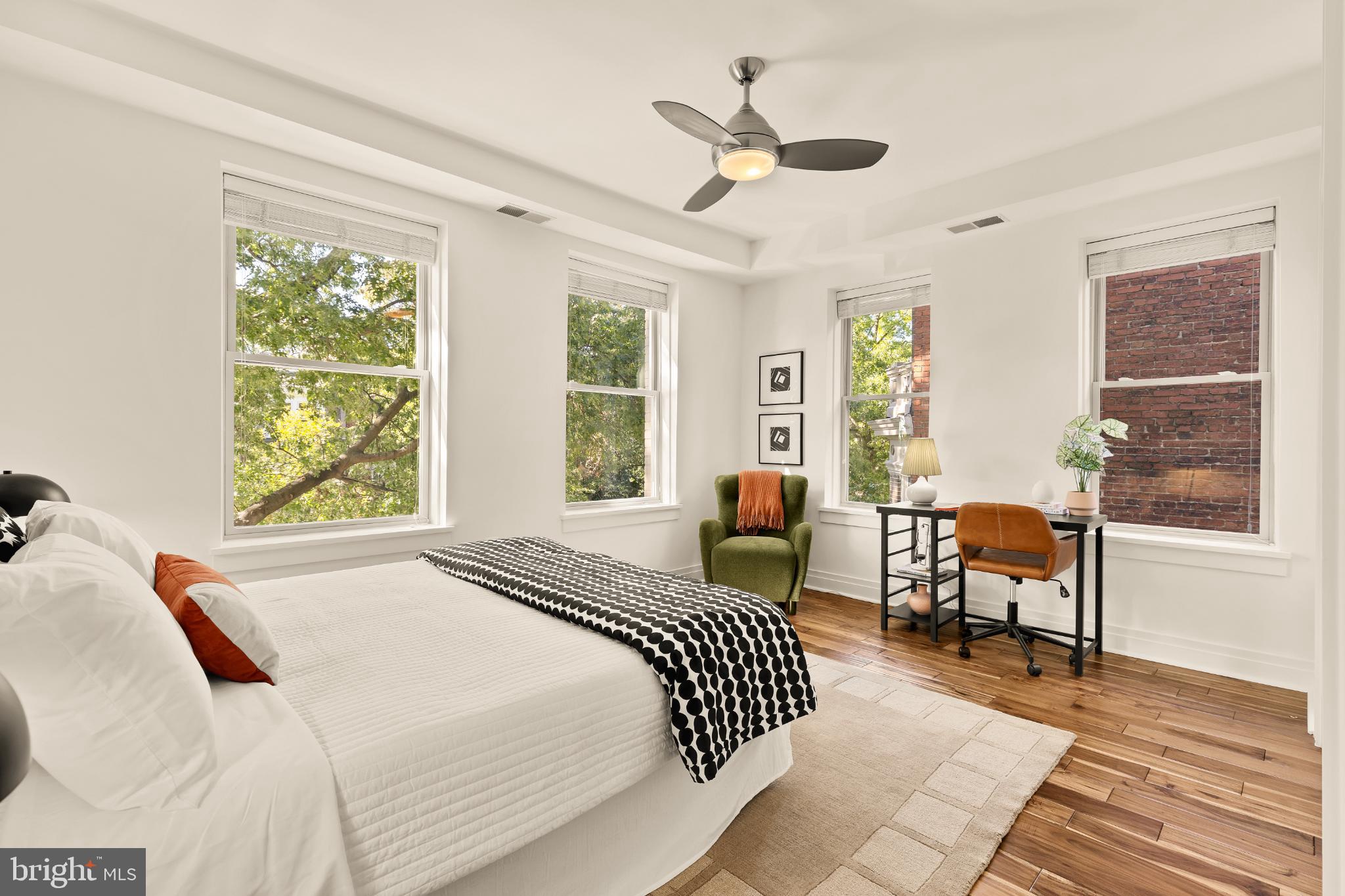 1811 Wyoming Avenue Northwest, Unit 32 Washington, DC 20009 - Photo 18 of 26 a bedroom with a bed and wooden floor