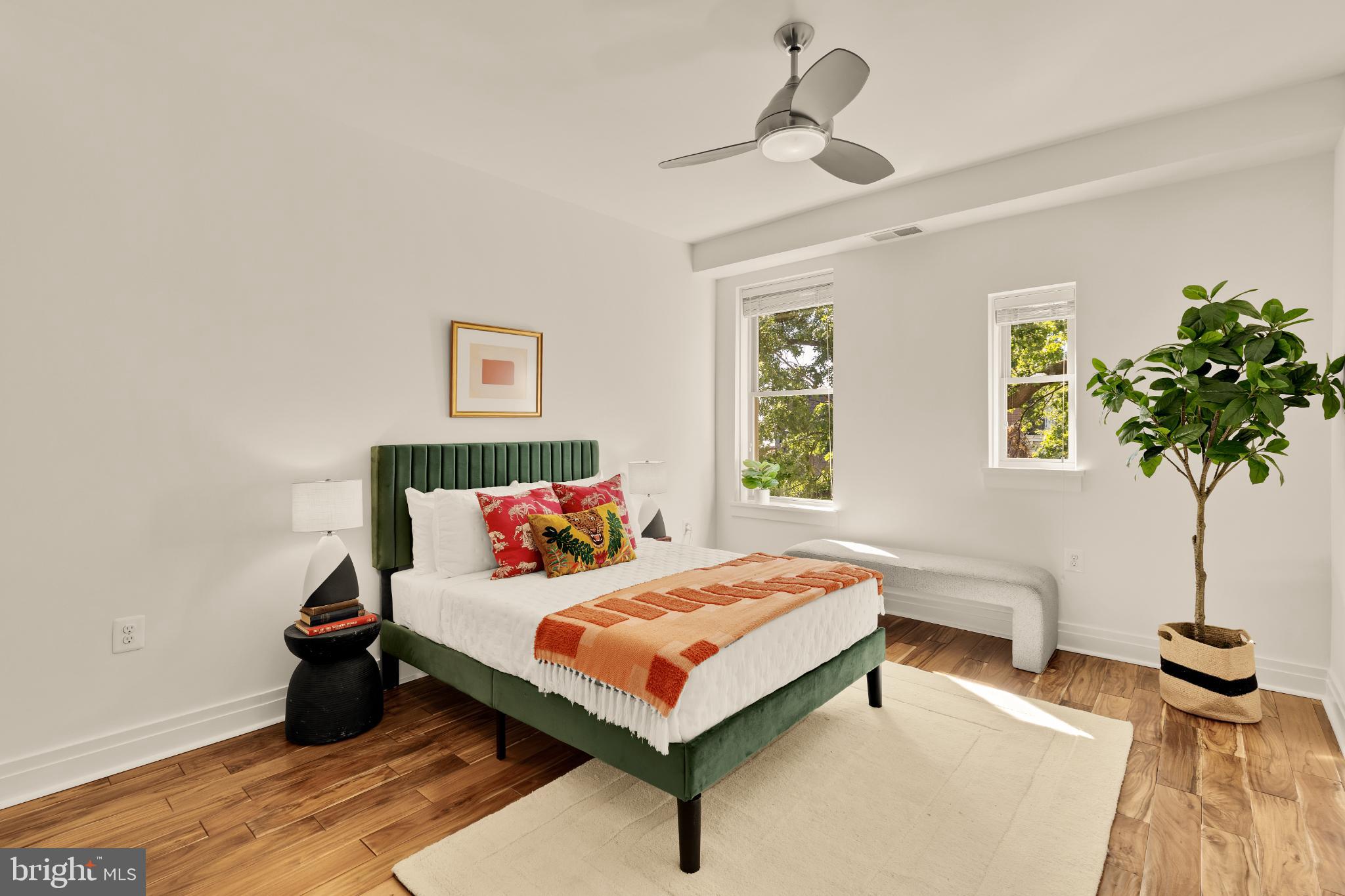1811 Wyoming Avenue Northwest, Unit 32 Washington, DC 20009 - Photo 20 of 26 a bedroom with a bed and a potted plant